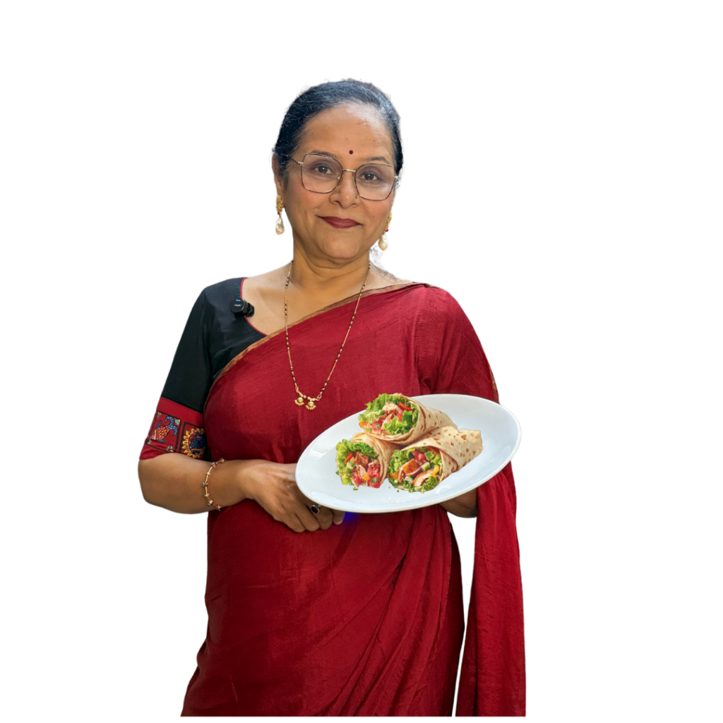 Ashwini Tarcar holding a traditional Goan dish